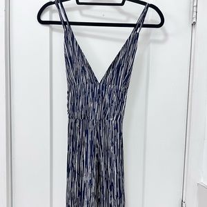 Club London navy and white plunge front jumpsuit.